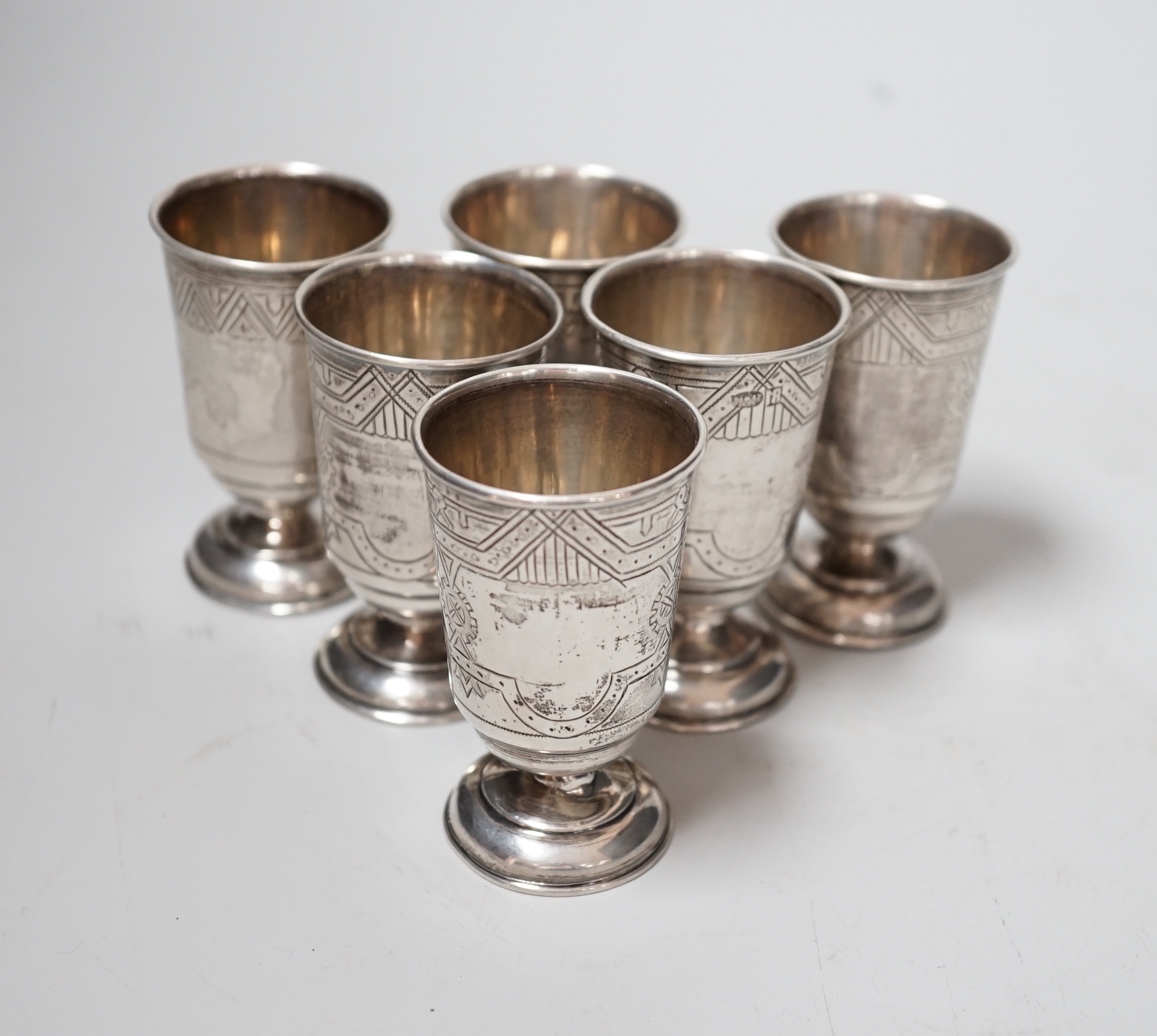 A set of six late 19th century Russian 84 zolotnik white metal pedestal tots, 65mm, 6.1oz.
